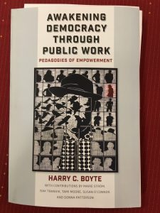 The cover of Awakening Democracy Through Public Work by Harry C. Boyte. Features silhouettes of birds and a humanoid figure intertwined in a pattern.